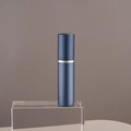 Matte blue 10ml refillable perfume spray bottle with silver ring on acrylic stand - 10ml / Blue
