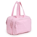 Pink quilted travel toiletry bag with double main zippers and front pocket on white background - Pink