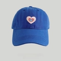 Washed blue cotton baseball cap featuring a pink embroidered heart patch on the front - Blue