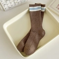 Dark brown ribbed mid-calf cotton socks with blue and white stripes in a cozy setup - One Size / Coffee
