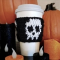 Handmade crochet mug sleeve with white skull pattern on black knit for Halloween party - Black White Skull