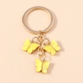Sweet acrylic butterfly keychain with three yellow marble charms on a gold chain ring - Yellow Texture (YZ172huangse)
