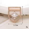 Detailed view of a gold shield brooch with large pearl and crystals, size 4.1cm x 3.2cm - Gold D1614 Shield