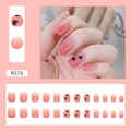Detail of R576 short square ombre pink press-on nails with black double heart patterns - R576 Gradient Heart