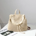 Beige woven straw backpack with tassels and brown straps for beach vacations - Off White