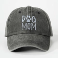 Close-up of washed cotton texture and DOG MOM embroidery on the dark grey baseball cap - One Size / Black