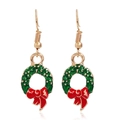 Close-up of Christmas wreath earrings with green enamel and red bow detail - Wreath #18