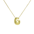 Macro shot of 18K gold plated bubble letter G pendant on a thin stainless steel chain - Gold G