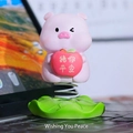 Pink pig bobblehead with apple and lucky message on a green lily pad base - 1188-31D Pig