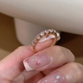 Elegant rose gold ring with seven round-cut pink crystals in a classic claw setting - Pink Pave Zircon