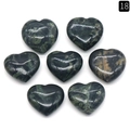 Set of seven dark green heart-shaped natural crystal stones with polished texture - Rhyolite