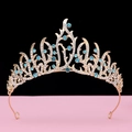 Detailed view of Baroque crown featuring light blue rhinestones on a gold hollow base - No.13 KC Gold (Lake Blue Stone)