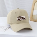 Detail of khaki cotton baseball cap with CELD letter embroidery in a lifestyle setting - Light Khaki / 54cm (3-8 Years)