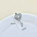 Detail showing heart-shaped silver key pendant with zircon inlays and dimensions - Silver-Key
