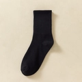 Women's black rib-knitted crew socks in a soft cotton blend, minimalist flat lay style - One Size / Solid Black