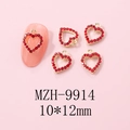Detailed view of red heart nail charm with gold metal base and sparkling rhinestones - Gold Heart Pave Red Rhinestone Charm (9914)