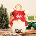 Lighted Christmas gnome plush with red sequin hat and warm festive background - Red