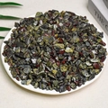 Polished natural multicolored tumbled stones in a white bowl for home decoration - Dragon Blood Stone (7-9mm) 100g