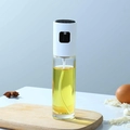 Glass oil sprayer with white pump head on a wooden board in a kitchen scene - 100ml / White