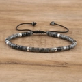 Detail view of emperor stone beaded bracelet with adjustable black braided rope and metal spacers - No.14 Labradorite