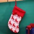 Red and white knitted Christmas stocking with reindeer pattern and pom-poms hanging decor - Reindeer Sock