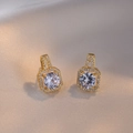 Elegant gold square halo stud earrings with round cubic zirconia on silk background - Gold Earrings