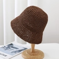 Handwoven brown straw sun hat for women displayed on a minimalist wooden stand - 6cm Brim / Brown