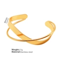 Brazalete minimalista de acero inoxidable dorado con un diseño geométrico cruzado en X - Color Oro Estilo Cruzado Irregular / Dorado