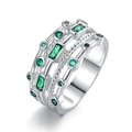 Multi-layer silver ring with emerald green stones and diamond accents on white background - US 6 / Green