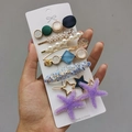 Dettaglio di un set di fermagli per capelli colorati con perle e stelle marine a mano - Stella Marina (Set da 8 Pezzi)
