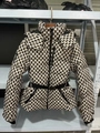 Detail of hooded ski jacket with geometric diamond pattern and waist-cinching belt - S / Tops / Rhombus Geometry