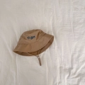 Detail of khaki bucket hat featuring Besttime embroidery and adjustable windproof drawstring - 52-54cm 3-6 Years / Khaki