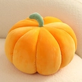 Orange corduroy pumpkin pillow on a white sofa, minimalist Nordic holiday home decor - Orange