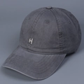 Close-up of vintage dark grey washed cotton baseball cap with white H letter embroidery - M (56-58cm) / Gray