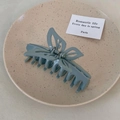 Detail of Morandi blue butterfly hair claw clip with matte finish and secure metal spring - Blue