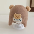 Detailed knit texture and plush pom-poms on a brown toddler bear earflap hat - 1-3 Years / Brown