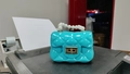 Blue mini jelly bag with quilted pattern, white pearl handle and golden metal clasp - Blue