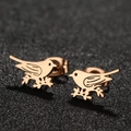 Elegant rose gold bird earrings with black feather details on dark textured surface - Bird / Rose Gold