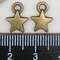 Bronze star charms with measurement ruler showing a width of 1.3cm for DIY jewelry making - Antique Bronze Small Star Charm (9x12mm)