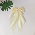 Elegant cream satin bow hair clip with long ribbons and smooth silky texture finish - Scarf Bow / Beige