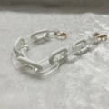 Detail of matte white and frosted acrylic chain link accessory with gold metal ring - 37cm / Frosted White