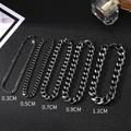 Men's stainless steel Cuban chain bracelets shown in five different widths from 3mm to 11mm - 0.5cm Width / Black