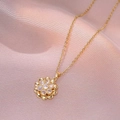 Elegant gold titanium spinning flower necklace with zircon crystals on purple silk - X3191 Gold Flower Rotating