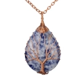 Macro shot of sodalite crystal pendant with copper wire wrapped tree of life detail - Lapis Lazuli Antique Bronze