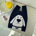 Dark blue knitted tote bag featuring a white cartoon dog pattern and soft woven texture - Cinnamon Dog Tibetan Blue