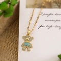 Detail of gold-plated bear pendant with white rhinestones and blue gemstone accent - Blue Color Block Bear (23653)