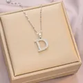Silver tone titanium steel D-letter pendant necklace with white crystals on gold box - 6065 Letter D Design / Silver
