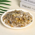 Natural bulk yellow citrine crystal gravel presented in a white ceramic plate - Titanium Crystal (7-9mm) 100g