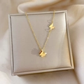 Macro detail of golden butterfly pendants on jewelry box with silk texture background - Gold (J318)