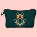 Detailed top view of a dark green Hamsa Hand travel pouch with zipper on pink background - Deep Green Hamsa Hand